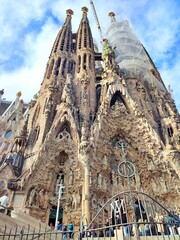 Exterior view of the Basilica de la Sagrada Familia, a Catholic church under construction in the Eixample district of Barcelona, Catalonia, Spain.