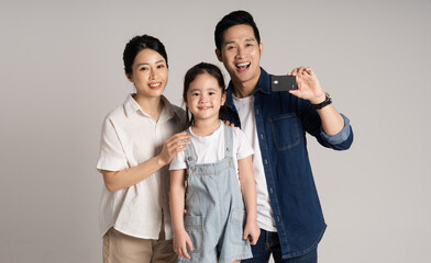 Asian family portrait posing on white background