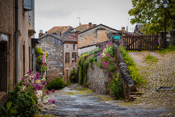 Old cobblestone medieval road in the town, the village of Cordes-Sur-Ciel in France