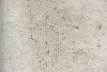 The texture of a gray concrete, old wall.