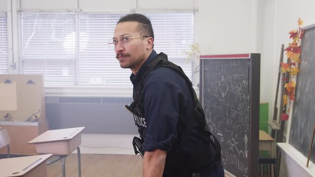 Police officer in a classroom teaching