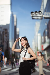 Youthful confidence, Cool and cheerful Japanese woman in her 30s, showcasing a perfect blend of style, confidence, and modern technology.