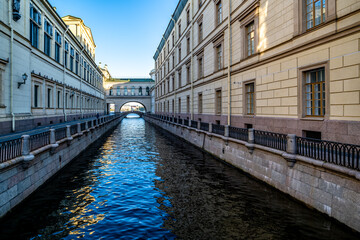 Fototapeta na wymiar A canal with water in the center of St. Petersburg. Granite embankment.