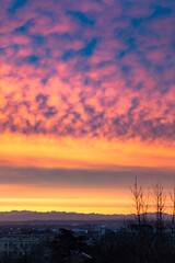 Sunrise with dramatic sky Panoramic, colorful pink-orange-blue dramatic sky with clouds illuminated by red sunset
