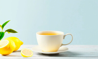 cup of tea and lemon on the table. Selective focus.
