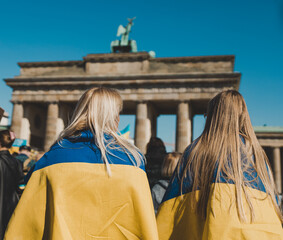 women draped in Ukrainian flag