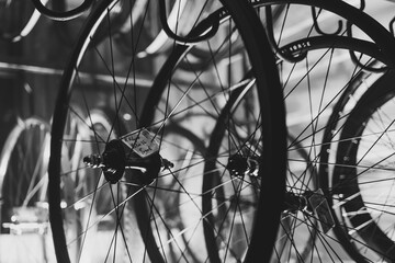 bicycle wheel rims hanging on hangers