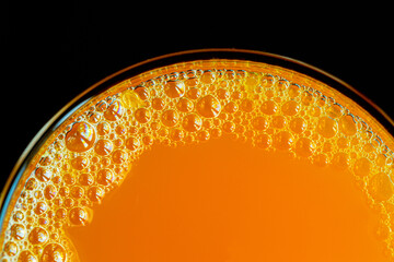 Macro orange juice texture,Diet healthy nutrition. Fresh yellow fruits juice background texture....