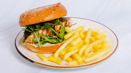 Burger and fries on plate