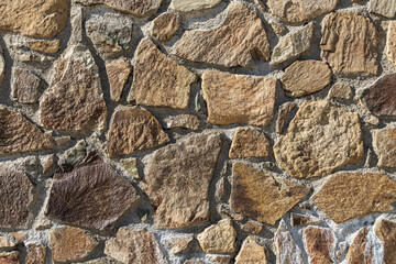 Yellow brown stone texture. Stone wall background