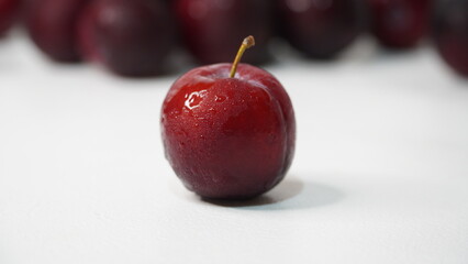 Fresh red plums isolated on a white background