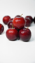Fresh red plums isolated on a white background