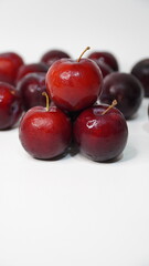 Fresh red plums isolated on a white background