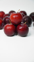 Fresh red plums isolated on a white background