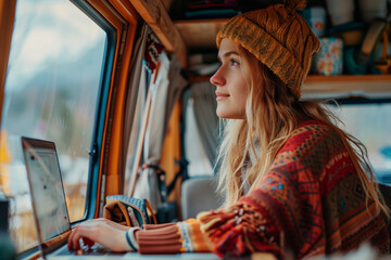 Young woman digital nomad engaging in remote work outside her vintage camper van