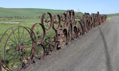 photo of artistic antique wheel fence that surrounds the famous dahmen barn at uniontown washington...