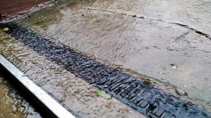 Water running over bricks after heavy rain storm - 750053227