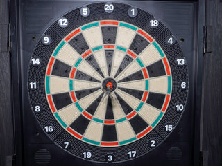 dart board with darts. dart in the target. concept hitting the target