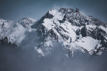 Fototapeta na wymiar Snowcapped mountains against blue sky.