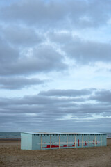 view of wooden huts on the beach on cloudy sky background  - 750064486