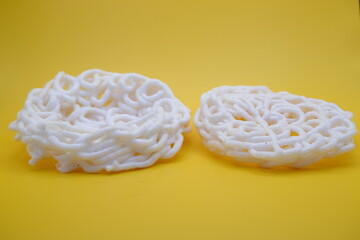 white shrimp crisp isolated on yellow background