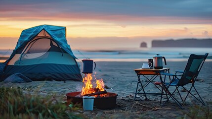 Coffee pot on camping fire, tent, folding chair table. Morning mist view on the beach background of campfire - obrazy, fototapety, plakaty