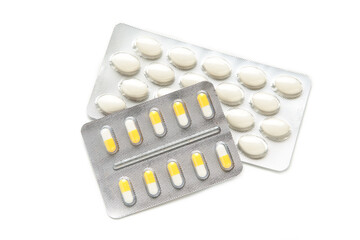 Medicine pills packed in blisters isolated on white background