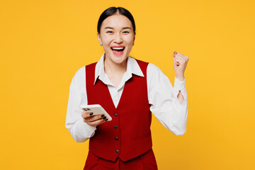 Young fun lawyer employee business woman of Asian ethnicity wear formal red vest shirt work at...