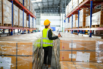 operation worker woman checking and inspecting cargo for stack items for shipping. Staff checking the store factory. industry factory warehouse. Worker Scanning Package In Warehouse.