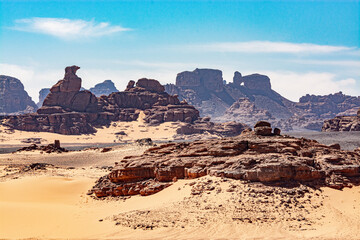 Tadrart landscape in the Sahara desert, Algeria. In this tortured landscape, the wind has sculpted...