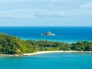 Tropical white sand beach with turquoise sea water. Cabangajan Island. Santa Fe, Tablas, Romblon. Philippines.