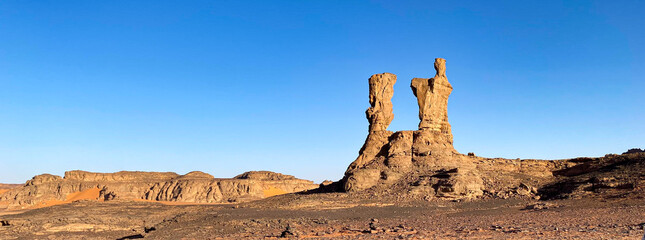 Landscape of Tadrart in the Sahara Desert, Algeria. The wind and sand have sculpted these mysterious characters in the sandstone of this rock formation