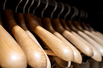 Wooden hangers for sale on a rack