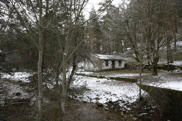 Abandoned house by a stream north of Madrid