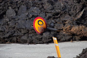 Traffic sign destroyed by the lava river after the second eruption near Grindavik in Iceland in 2024