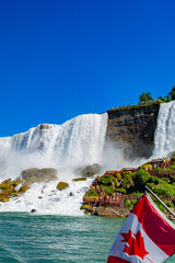 View on the Bridal Veil Falls and American Falls of the Niagara Falls and Canadian flag, the part...