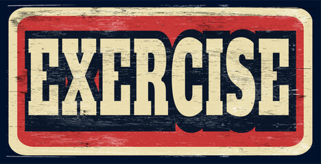 Aged and worn exercise sign on wood