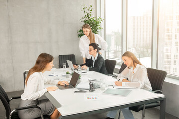 Business women working in modern office, free space