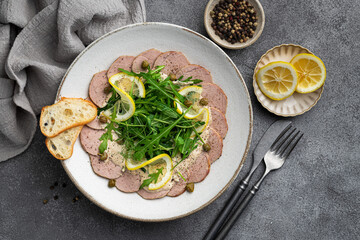 Italian Vitello Tonnato in a ceramic plate, view from above