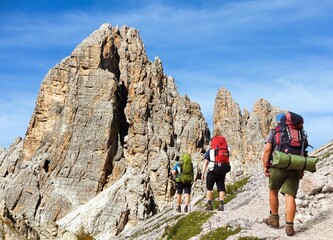 Cima Ambrizzola and Croda da Lago with three hikers