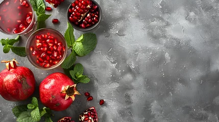 Keuken foto achterwand Koffiebar Ripe red pomegranate. Ripe grains of pomegranate on the table. Pomegranate juice,Ripe pomegranates with leaves. On a rustic background,Fresh and healthy pomegranate on a grey background, 