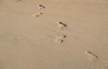 Fototapeta na wymiar footprints in sand