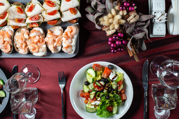 Bruschetta with shrimp, ham, cream cheese, cherry tomatoes and Greek salad of fresh cucumber, tomato, sweet pepper, lettuce, feta cheese and olives.