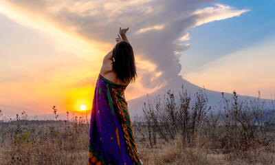 A young dancer, with long flowing hair, dancing in a mountainous landscape at sunset. Concept:...