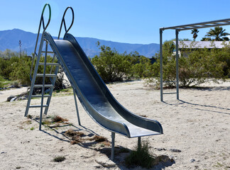 1950s era metal playground equipment in the desert - Powered by Adobe