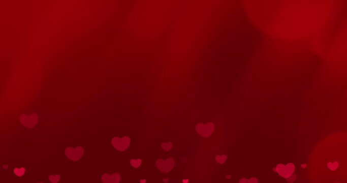 Animated romantic red hearts on red background with bokeh effects for Valentine's day and wedding concept