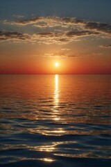 Obraz premium Sunset over the endless ocean with reflection