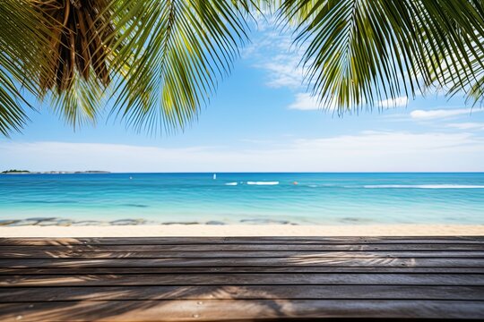 Top of wood table with palm tree leaves sea and sky background with summer holiday vacation and sunny tropical beach