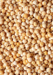 Texture of Organic Dried Yellow Whole Peas. Pulses Variety. Raw Uncooked Peas Background.