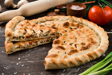 Ossetian closed pie with chicken, onions, tomatoes, herbs and spices. - 750131647